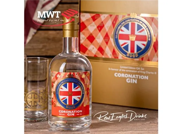 Limited edition Coronation Gin bottle and glass set by Real English Drinks Distillery, featuring a Union Jack label and gold crown emblem, presented with commemorative packaging for the coronation of King Charles III. MWT logo appears in the top left.